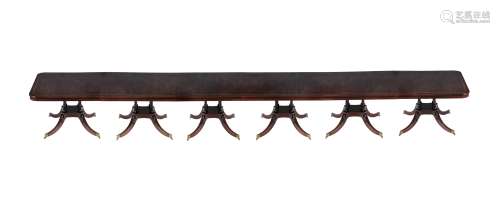A mahogany six pillar dining table in Regency style