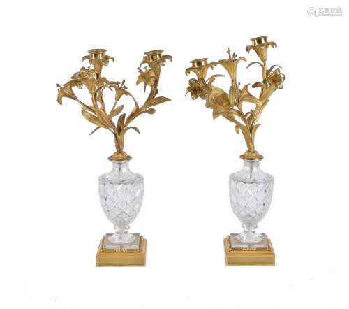 A pair of gilt metal and cut glass two light candelabra