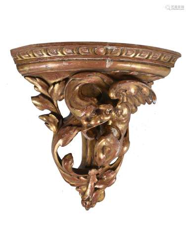 A Gothic Revival carved and giltwood corner bracket