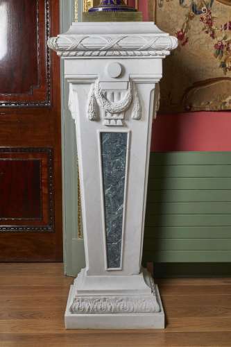 A pair of white marble and verde antico stands in the Neo-Classical manner