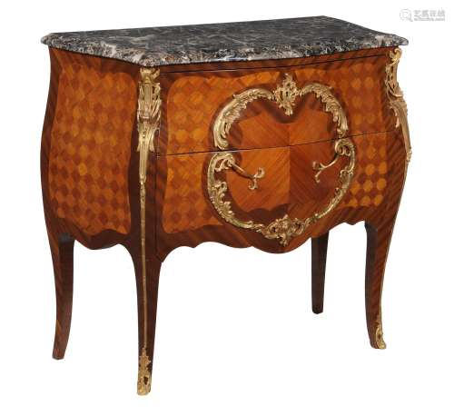 A French mahogany kingwood, parquetry, and gilt metal mounted commode in Louis XV style