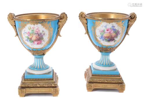 A pair of French porcelain Sevres-style gilt-metal mounted urns