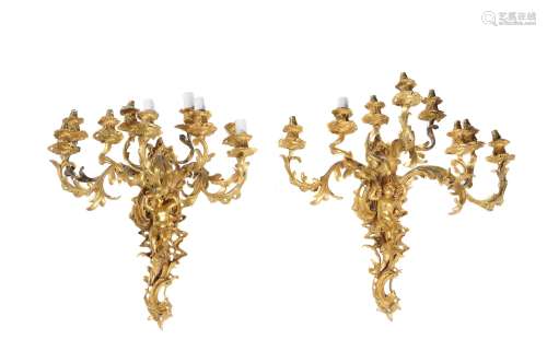 A pair of French gilt bronze nine light wall appliques in Louis XV style