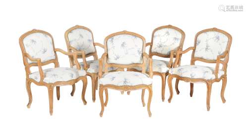 A set of ten carved beech wood elbow chairs