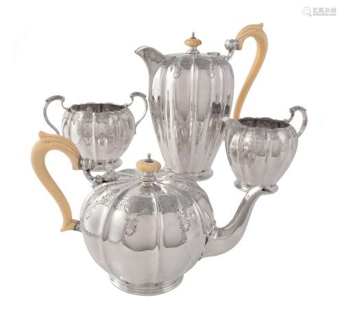 A silver melon shaped four piece tea service by The Goldsmiths & Silversmiths Co. Ltd