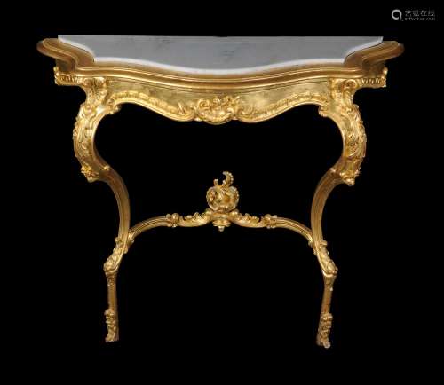 A carved giltwood console table in 18th century style
