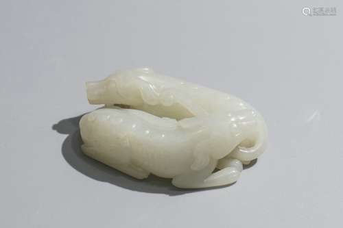 A Carved Jade Figure Of Twin Beasts