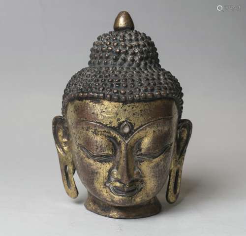 A Bronze Head Of Buddha