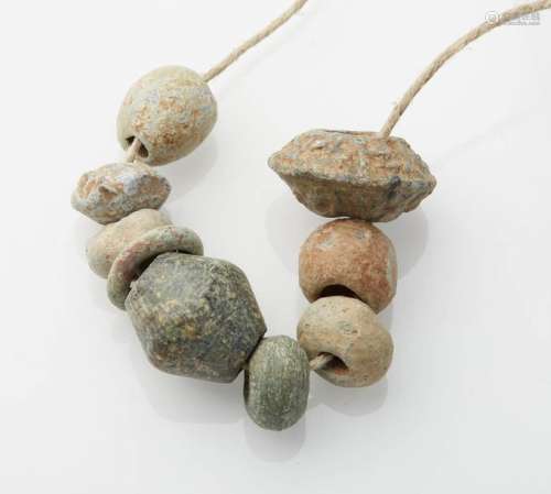Necklace mainly composed of stone or lead beads. G…