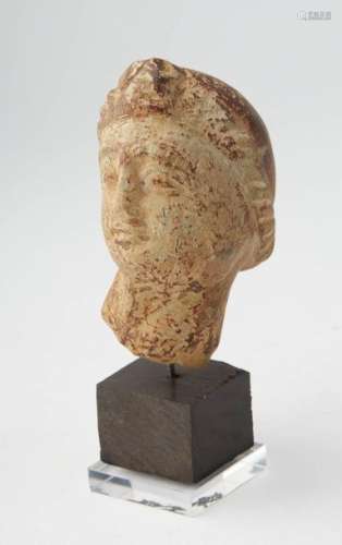 Female head made of stone (hard limestone). Roman …