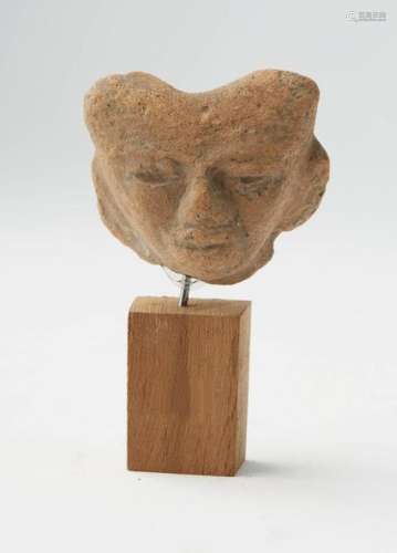 Terracotta head. This head comes from the site of …