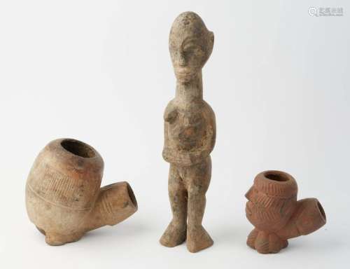 Wooden statuette, old African work. Two large pipe…