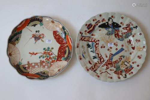 Japan. Two round porcelain plates with poly lobed …