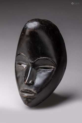 DAN, Ivory Coast. nWood, black patina. nClassical …