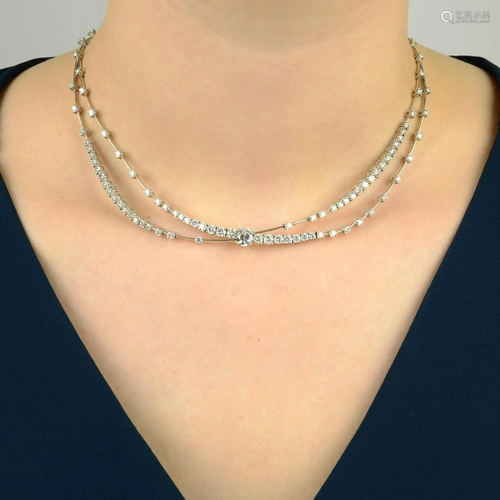 A brilliant-cut diamond crossed swag necklace, by