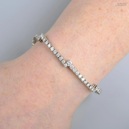 An 18ct gold diamond stepped line bracelet. Total