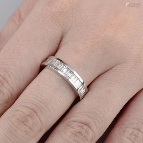 A baguette-cut diamond full eternity ring.Total diamond