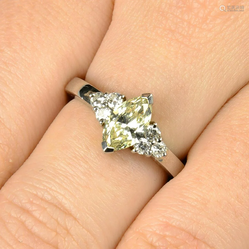 A platinum marquise-shape 'yellow' diamond ring, …