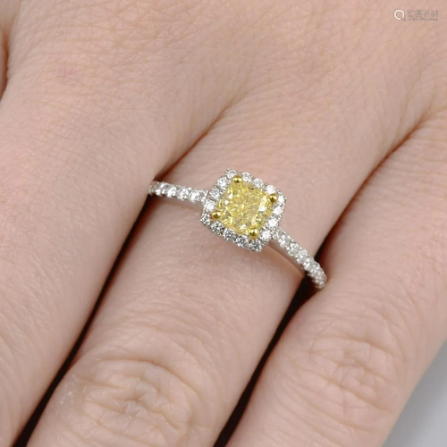 A 'Yellow' diamond and diamond cluster ring.'Yellow'