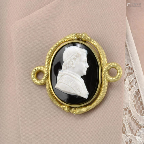 An onyx cameo brooch, within coiled serpent surround