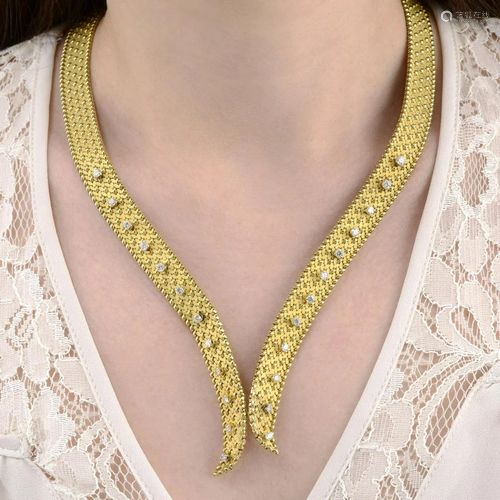 A 1970s 18ct gold textured necklace, with brilli…