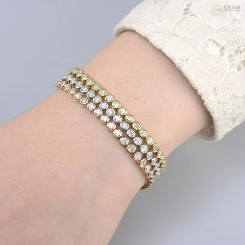 A tri-colour 18ct gold brilliant-cut diamond bracelet,