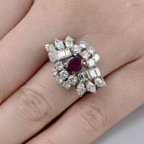 A platinum ruby and vari-cut diamond cluster