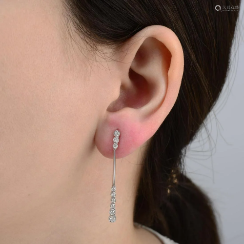 A pair of brilliant-cut diamond drop earrings.Total