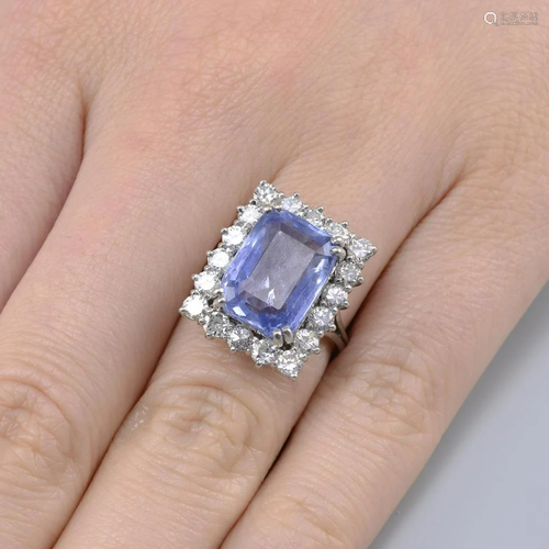 A Sri Lankan sapphire and circular-cut diamond