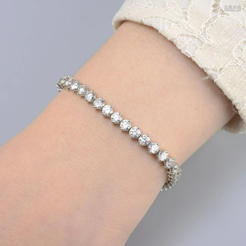 A brilliant-cut diamond line bracelet. Estimated total