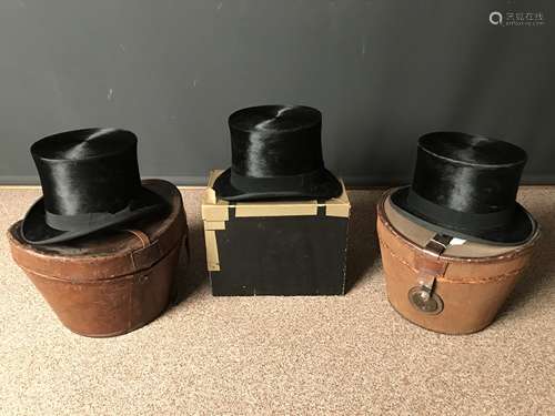 Three early 20th century top hats,