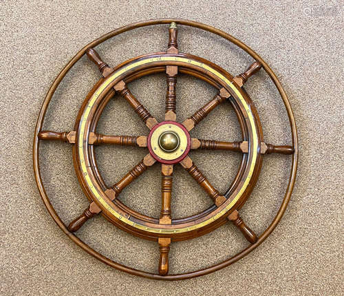 A late 19th or early 20th century ash ship's wheel,