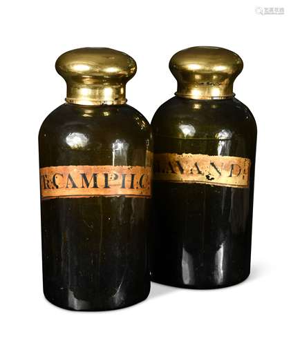 Two green glass pharmacy jars with gilt covers, 19th century,