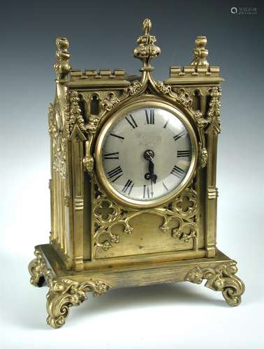 A 19th century 'gothic' case lacquered brass mantle timepiece,