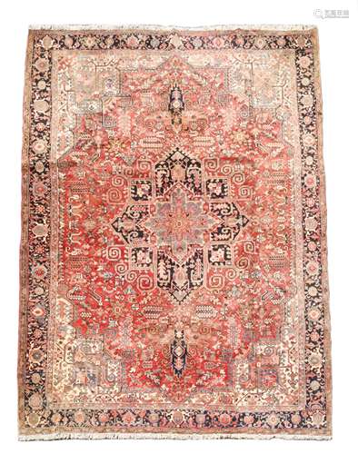 A Heriz carpet,