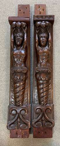 A pair of 17th century carved oak herms,