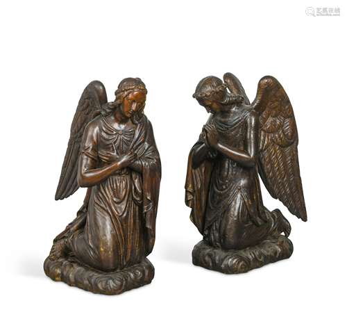 A pair of Continental 17th century carved softwood kneeling angels,