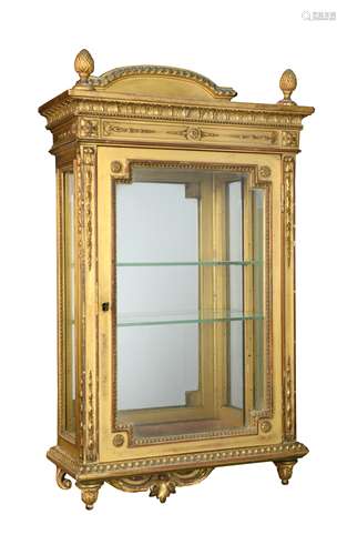 A giltwood wall cabinet, 19th century,