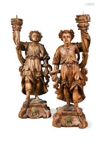 A pair of Continental carved limewood pricket stands, 17th century,