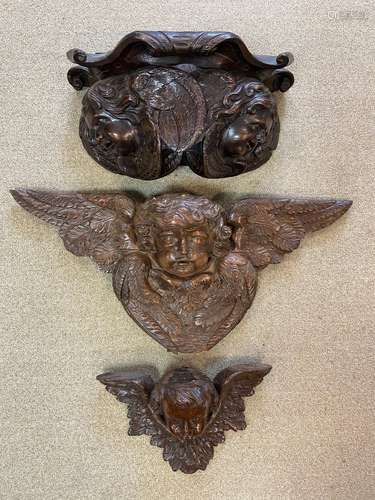 Two carved cherubic wall brackets, late 17th or early 18th century,