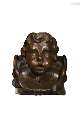 An imposing carved cherub head wall mount, late 17th or early 18th century