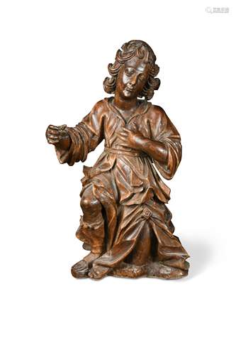 A carved figure of a kneeling male, probably late 17th or early 18th century,