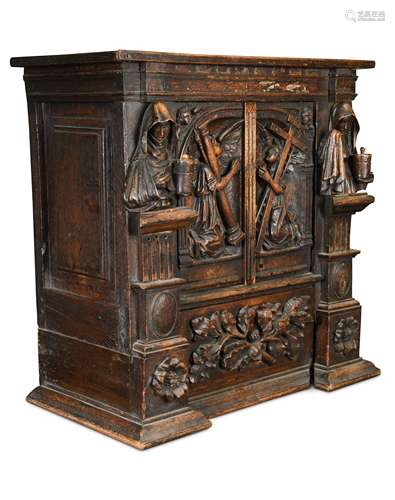 A North European carved oak cabinet of small proportions, late 17th or early 18th century,