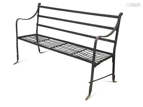 A Regency wrought iron strap work garden bench,