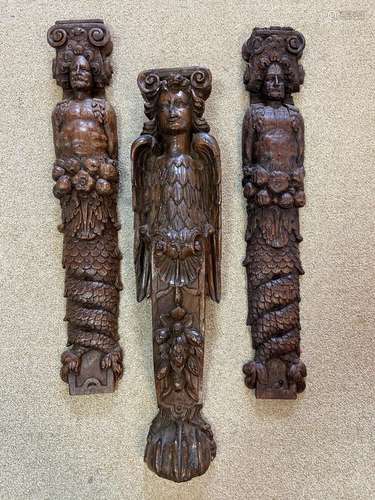 A pair of carved oak herms, probably 17th century,