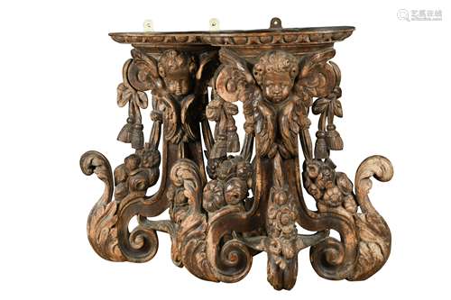 A pair of 17th century carved limewood wall brackets,