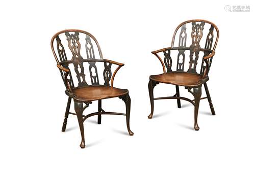 A pair of yew and mahogany gothic Windsor armchairs, mid 18th century,