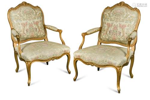 A pair of Louis XV style gilt framed fauteuils, circa 1900,