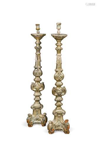 A pair of large Baroque style silver giltwood prickets, 18th century