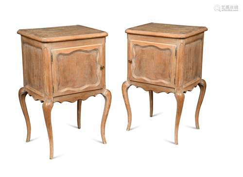 A pair of French provincial bleached-oak night tables,